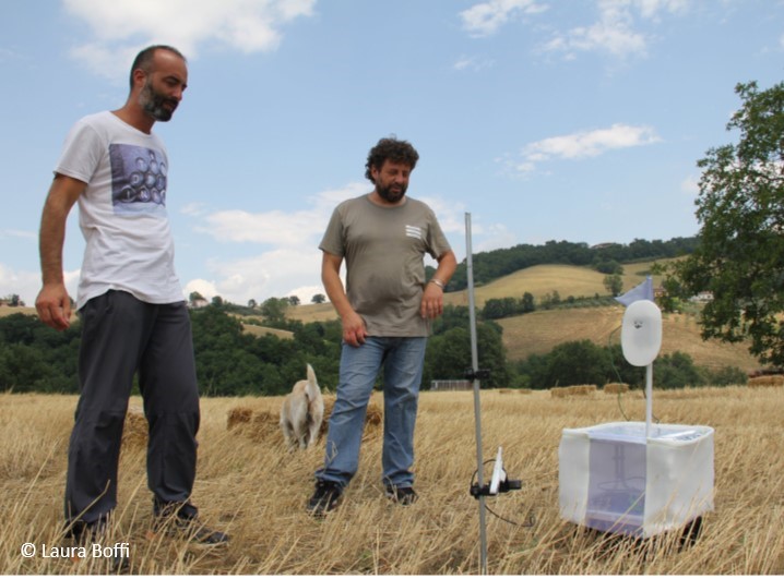 Farmers with a pollinator monitoring robot